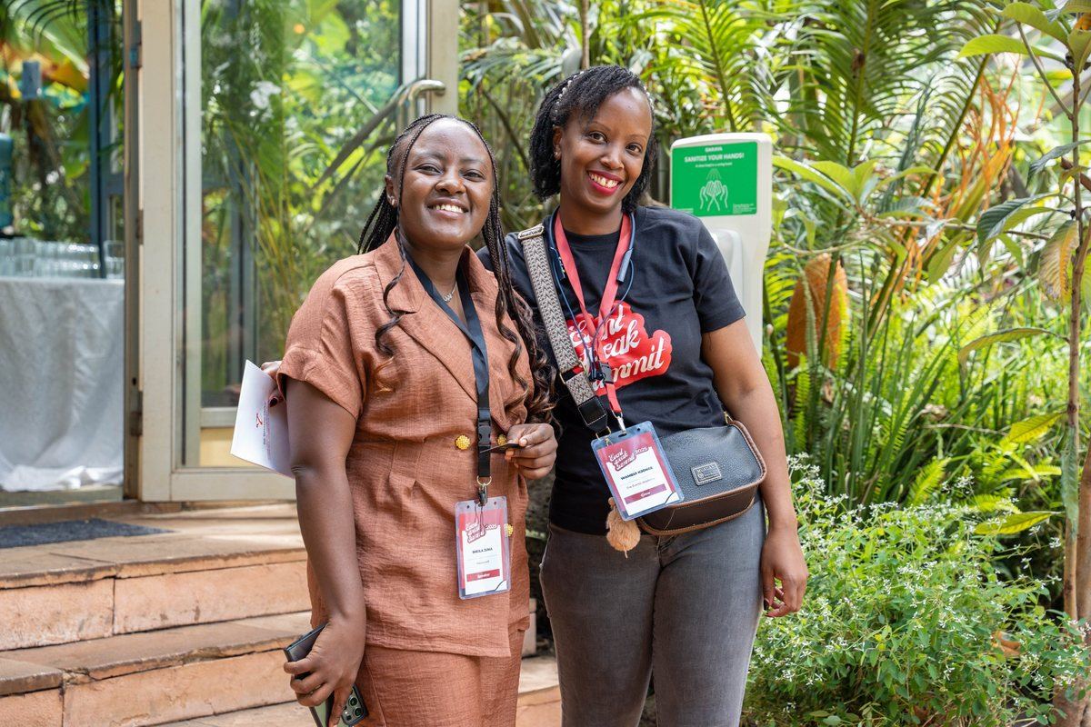 A speaker and a crew member at the summit